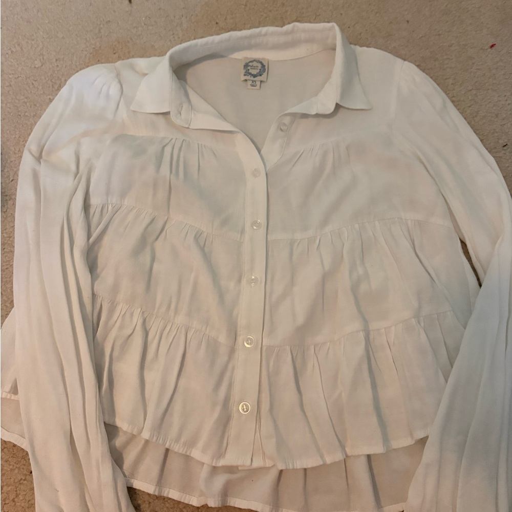 Francesca’s White blouse with ruffles and buttons. Size: XS